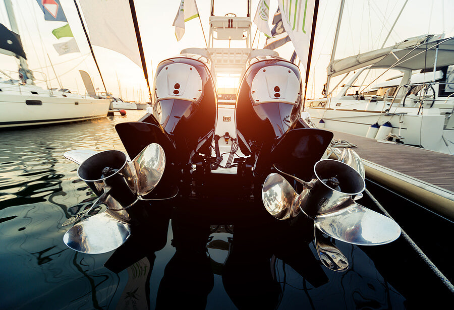 Boat Maintenance docked boat with engines raised and propellers showing